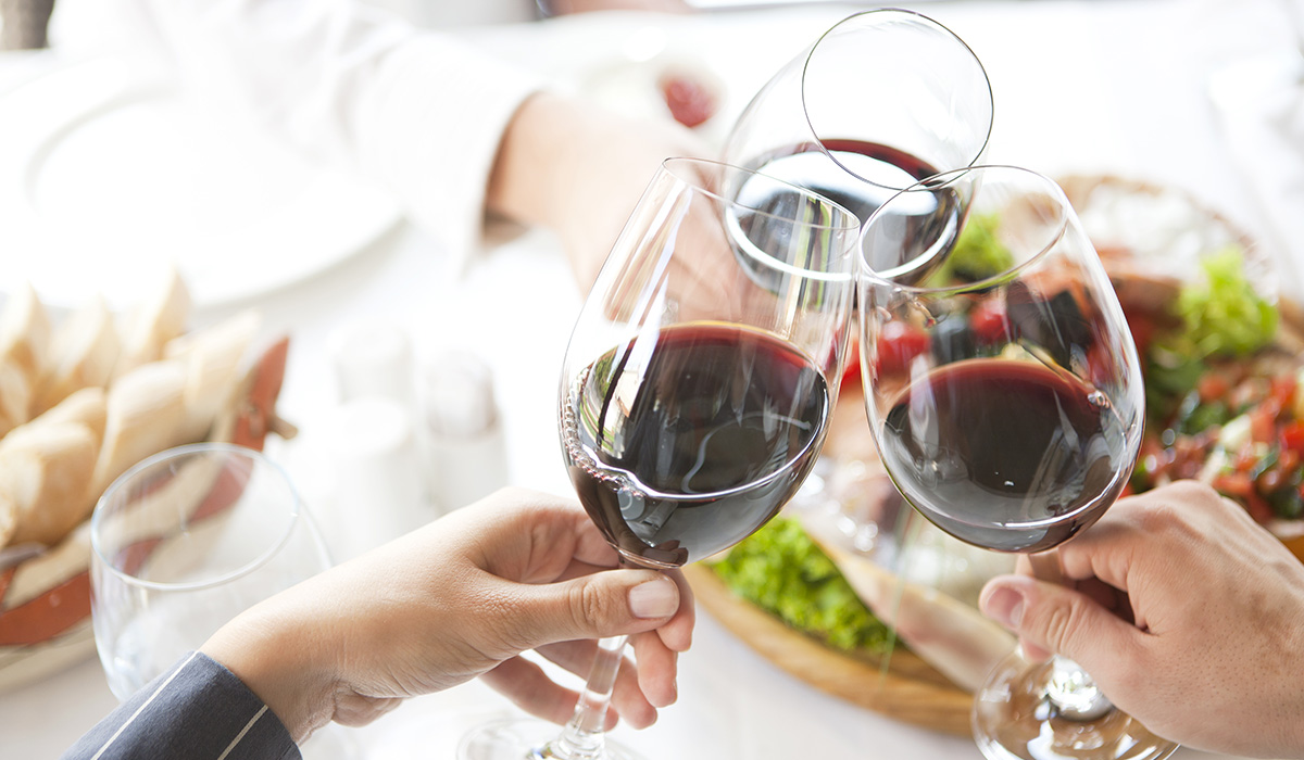 toast with three wine glasses