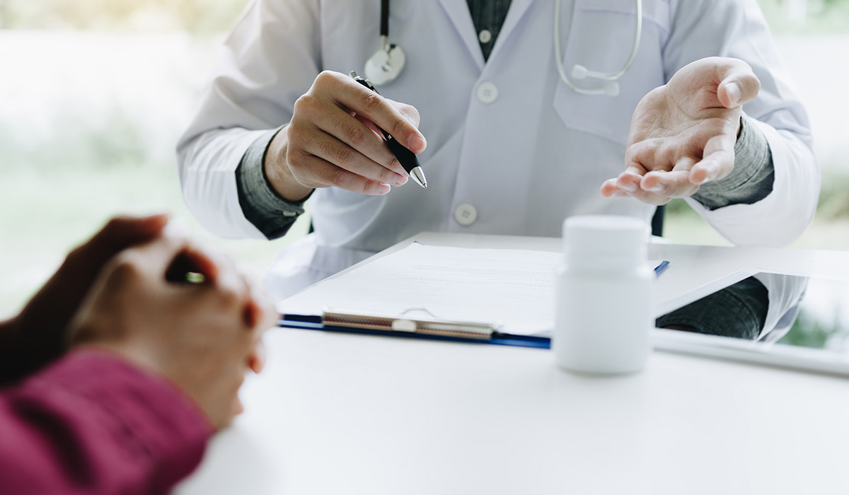 A doctor consulting with a patient