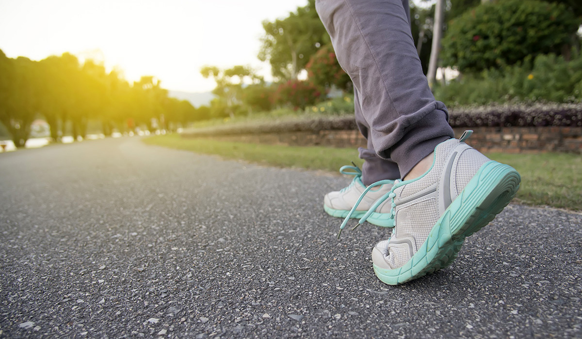 A runner's legs and feet while running outdoors