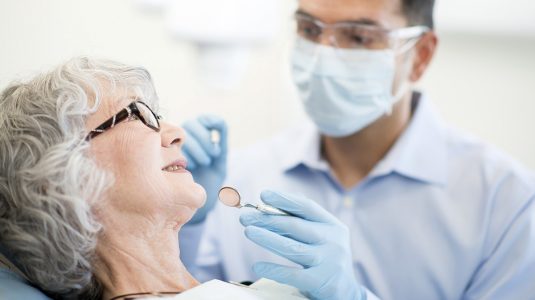 A senior at a dentist for a routine checkup