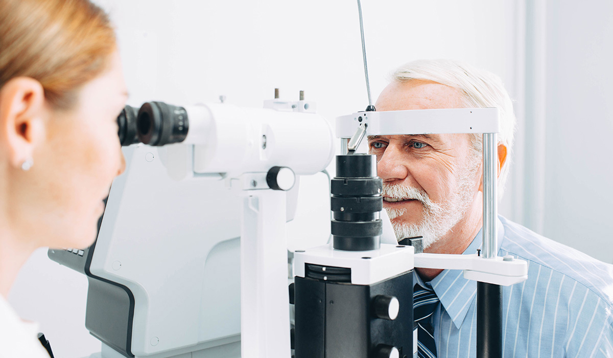 Senior man examined by an ophthalmologist