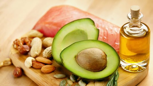 avocado, nuts, salmon, and oil to represent sources of healthy fat