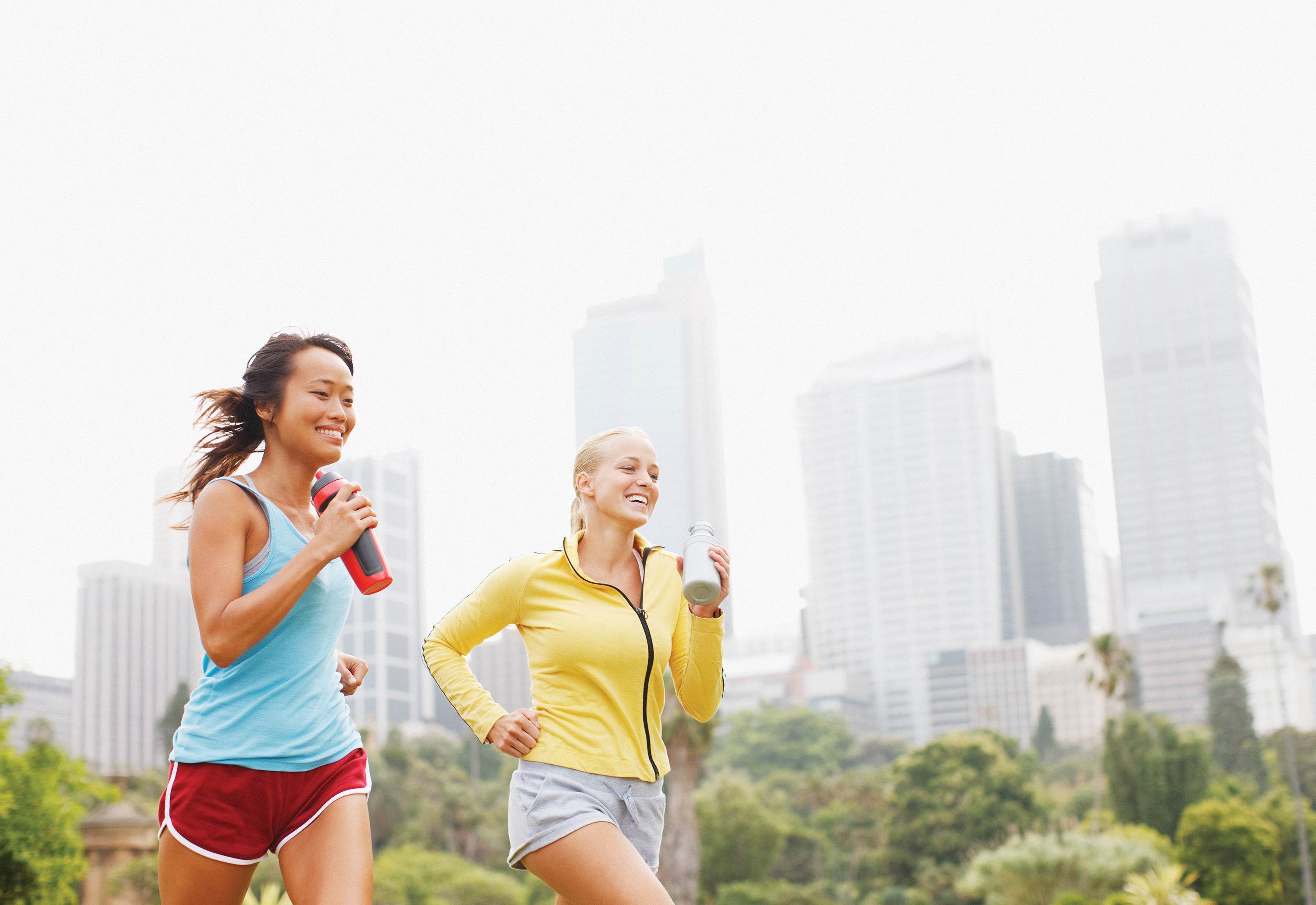friends running in urban park