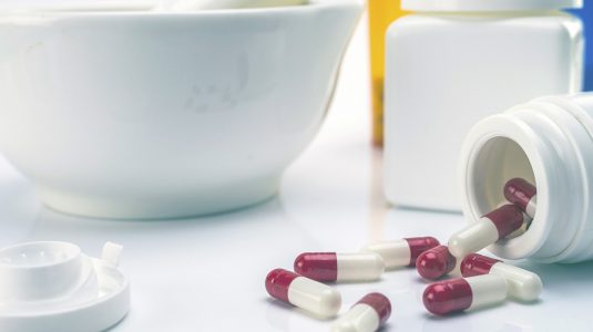 Pills spilled out on a table