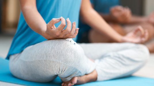 A person taking a meditation posture