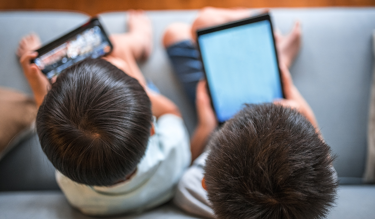 Children using tablets in a controlled manner, demonstrating balanced screen time