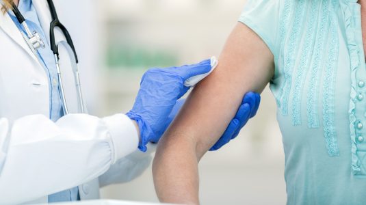 A person getting a flu shot