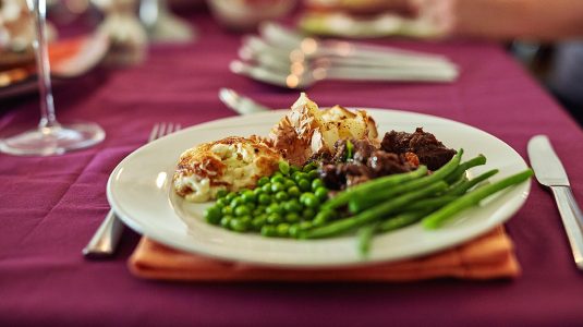 Plate of dinner with meat and vegetables