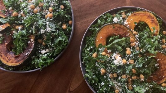 Two bowls of roasted kobuhca squash and kale salad