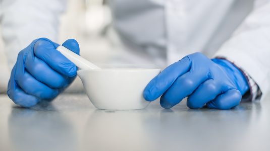 Chemist performs an experiment with liquid nitrogen
