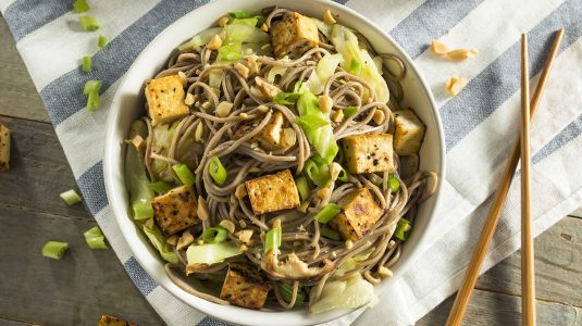 Homemade Asian Tofu Soba Noodle Bowl with Onions and Peanuts