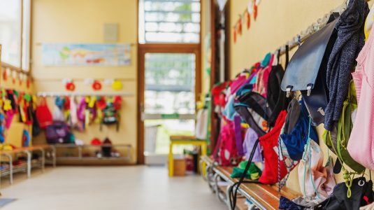 Daycare room with children's belongings