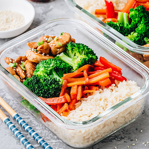 A healthy meal with chicken, veggies, and rice