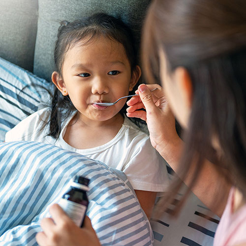 A child getting her medicine