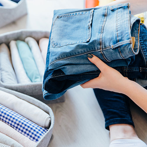 Person folding laundry