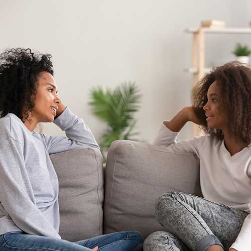 Family speaking with each other on the couch